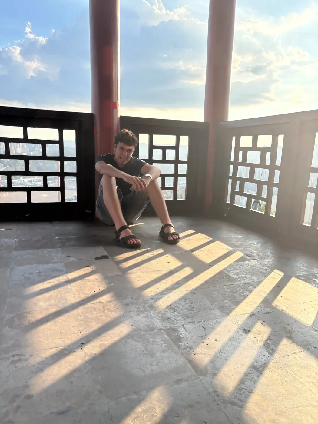 Sylvan sitting in a pagoda high above a city